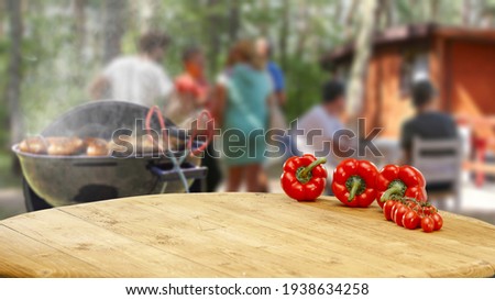 Table background of free space and grill time in garden 