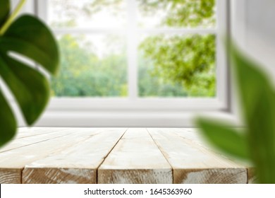 Table background of free space and spring blurred window sill. - Shutterstock ID 1645363960
