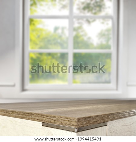 Table background of free space and window in home interior 