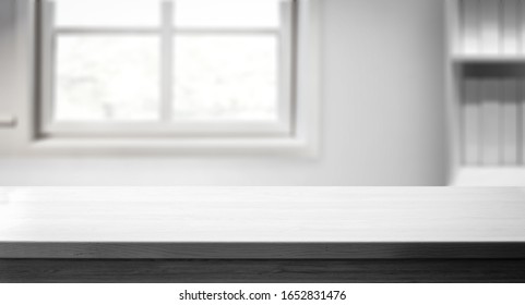 Table background of free space for your decoration and whte home interior with big window.Spring time and sunny day. 