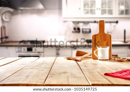 Table background in kitchen and fresh milk 