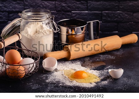 Table with baking products and tools. Culinary, baking concept.