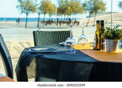 Table At A Beachfront Restaurant Ready To Eat