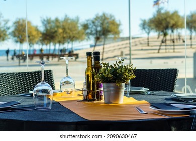 Table At A Beachfront Restaurant Ready To Eat