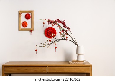 Table with beautiful decorations for Chinese New Year celebration in room - Powered by Shutterstock