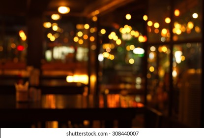 Table In Blur Pub Or Bar Nightclub And Restaurant At Christmas Night Celebrate Party With Bokeh Light Background