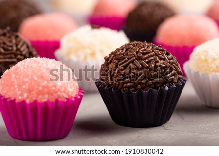 Table with brigadeiro and various party sweets. Image with selective focus.