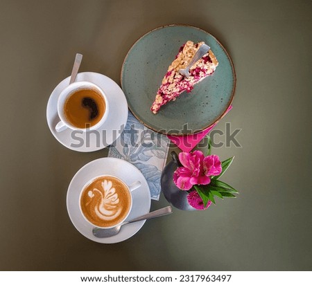 Table with cake, espresso black coffee, cappuccino with Latte art in the shape of a swan.