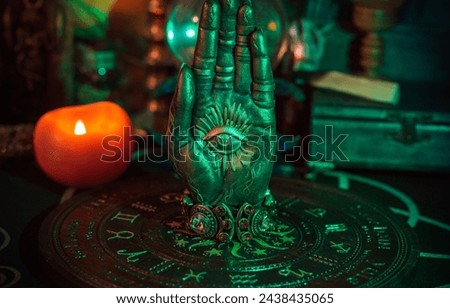 Table with candles and esoteric stuff. Herbs and wax around. Rite concept 