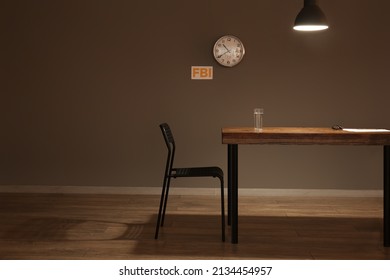 Table And Chair In Empty Interrogation Room