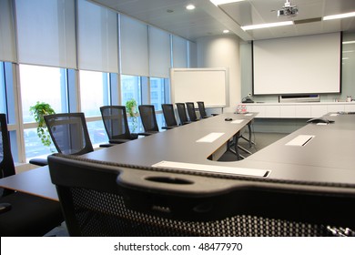 table and chairs in the boardroom - Powered by Shutterstock