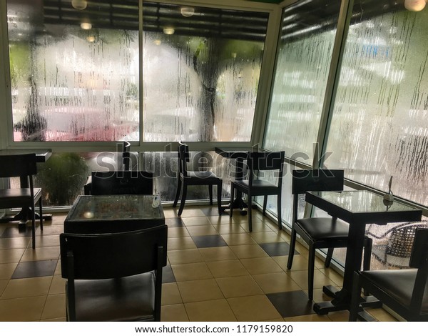 Table Chairs Cafe On Rainy Day Stock Photo Edit Now 1179159820