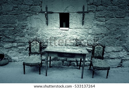 Table and chairs of the Inquisition, detail of a scene from the old Spanish Inquisition, religicion and furniture