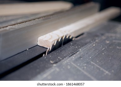 Table and a circular blade circular sawing machine. Close-up photo