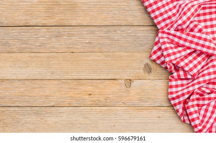 Table cloth red covered wood background, top view with copy space.