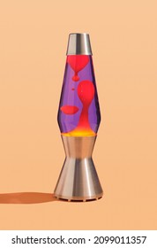 Table colorful lava lamp with flowing traceries. Peace and comfort in interior. Retro style.