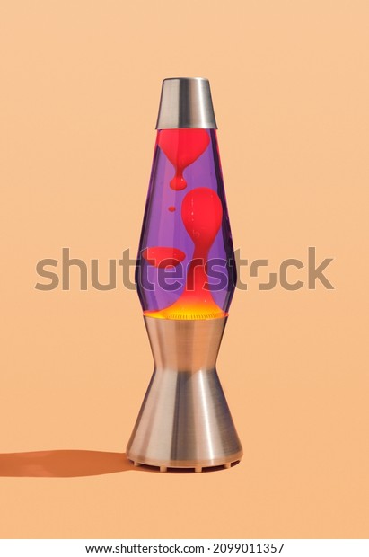 Table colorful lava lamp with
flowing traceries. Peace and comfort in interior. Retro
style.