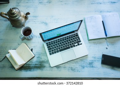 Table with computer and notebook