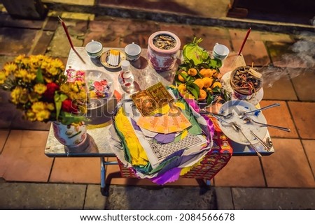 The table is covered with gifts to the gods. Offering to the gods in Vietnam