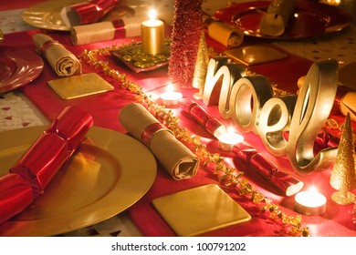 Table Decorated Red And Gold For Christmas Day Dinner