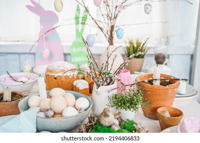 Table Decoration For Easter Celebration In Kitchen.Tablescape For Easter Holiday At Home.Family Religious Traditional Festive Christianity,catholic Meal Food.Pop Color Eggs,cake,fun Bunny,candy Sweet.