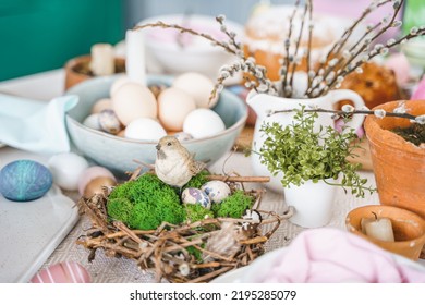 Table Decoration For Easter Celebration In Kitchen.Tablescape For Easter Holiday At Home.Family Religious Traditional Festive Christianity,catholic Meal Food.Pop Color Eggs,cake,fun Bunny,candy Sweet.