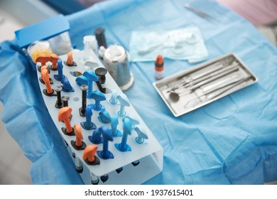 Table With Dental Composite Resins Stand Near Instrument Tray