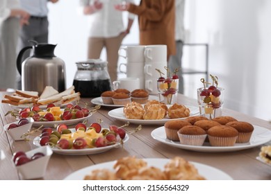 Table with different delicious snacks indoors. Coffee break - Powered by Shutterstock