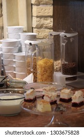 Table with dishes.  Set for Breakfast.