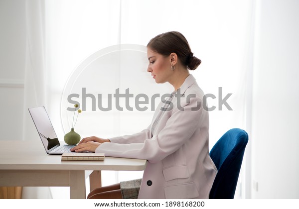 Table divider with\
woman working on a laptop
