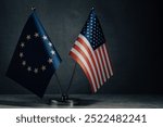 Table flags of United States and European Union on dark background