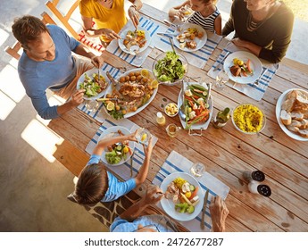 Table, food and top view of family for lunch, supper and eating meal at home together. Celebration, parents and children with dish for bonding, relax and talking for nutrition, health and wellness - Powered by Shutterstock