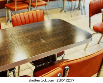 A Table With Four Chairs In An American Diner House.