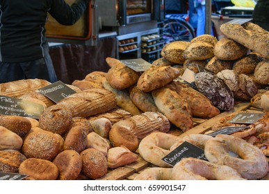 Table full of bread with dutch signs