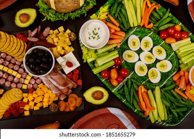 Table Full Of Delicious Snack For Football Game Watching Party For Fans.