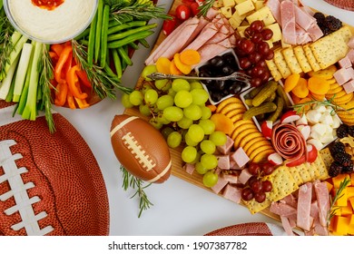 Table Full Of Delicious Snack For Football Game Watching Party For Fans.