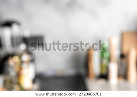 Table with kitchen utensils out of focus. High quality photo