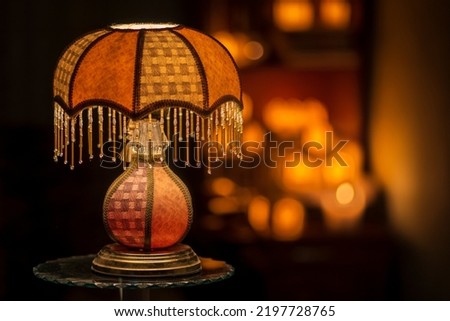 table lamp space for text book space for text  dark bedroom luxury orange  Old fashion night light Vintage Mood Retro Against Wall candle background.