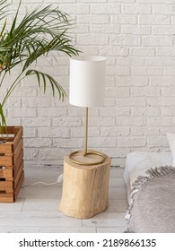 Table Lamp With White Lampshade In Bedroom. Natural