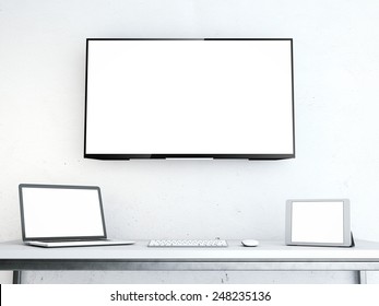 Table With Laptop And Large Screen On The Wall