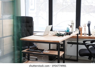 Table With Laptop At The Office Of Engineers Who Developing Artificial Limbs