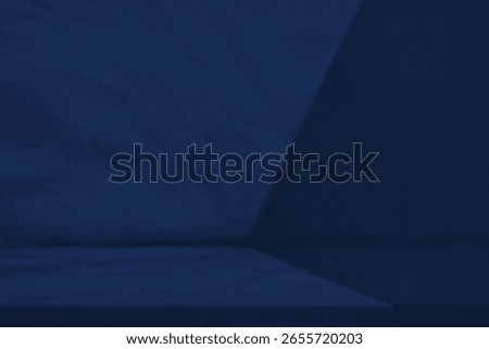 Table with Light Beam and Shadow on Dark Blue Wall Background, Suitable for Cosmetic Product Presentation Backdrop, Display, and Mock up.
