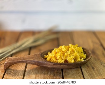 Table Made Of Oak Boards You Can See The Jars On Them There Is A Bunch Of Corn And A Wooden Spoon With Noodles A Wall Made Of Pine Boards Painted White