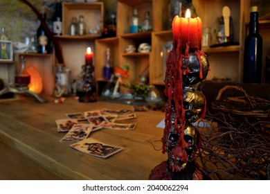 Table With Magical Props, Halloween Background With Skull Candelabra With Foreground.