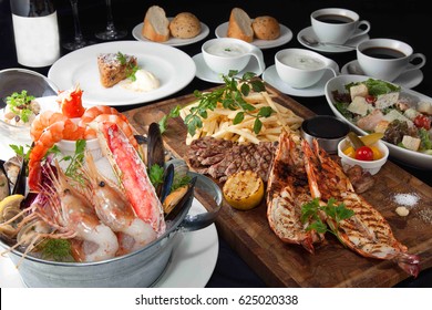 Table Meal Of Seafood Hot Pot , Beef, Bbq, Bread, Shrimp, Lobster And Wine