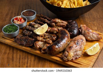 table of meat and grilled achuras