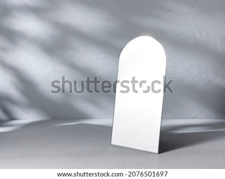 Table mirror on gray background