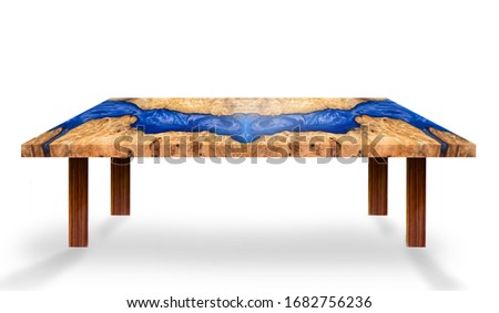 Table modern style made of casting epoxy blue resin maple burl wood  legs made of wooden on floor white background 