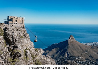 Table mountain cable car with a view towards the top cable way station, Cape Town, South Africa - Powered by Shutterstock