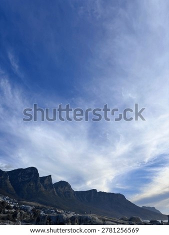 Table Mountain Cape Town with dramatic sweeping clouds and city below